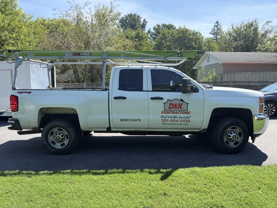 D&K Contractors work truck with ladder rack and MHIC license number 34676